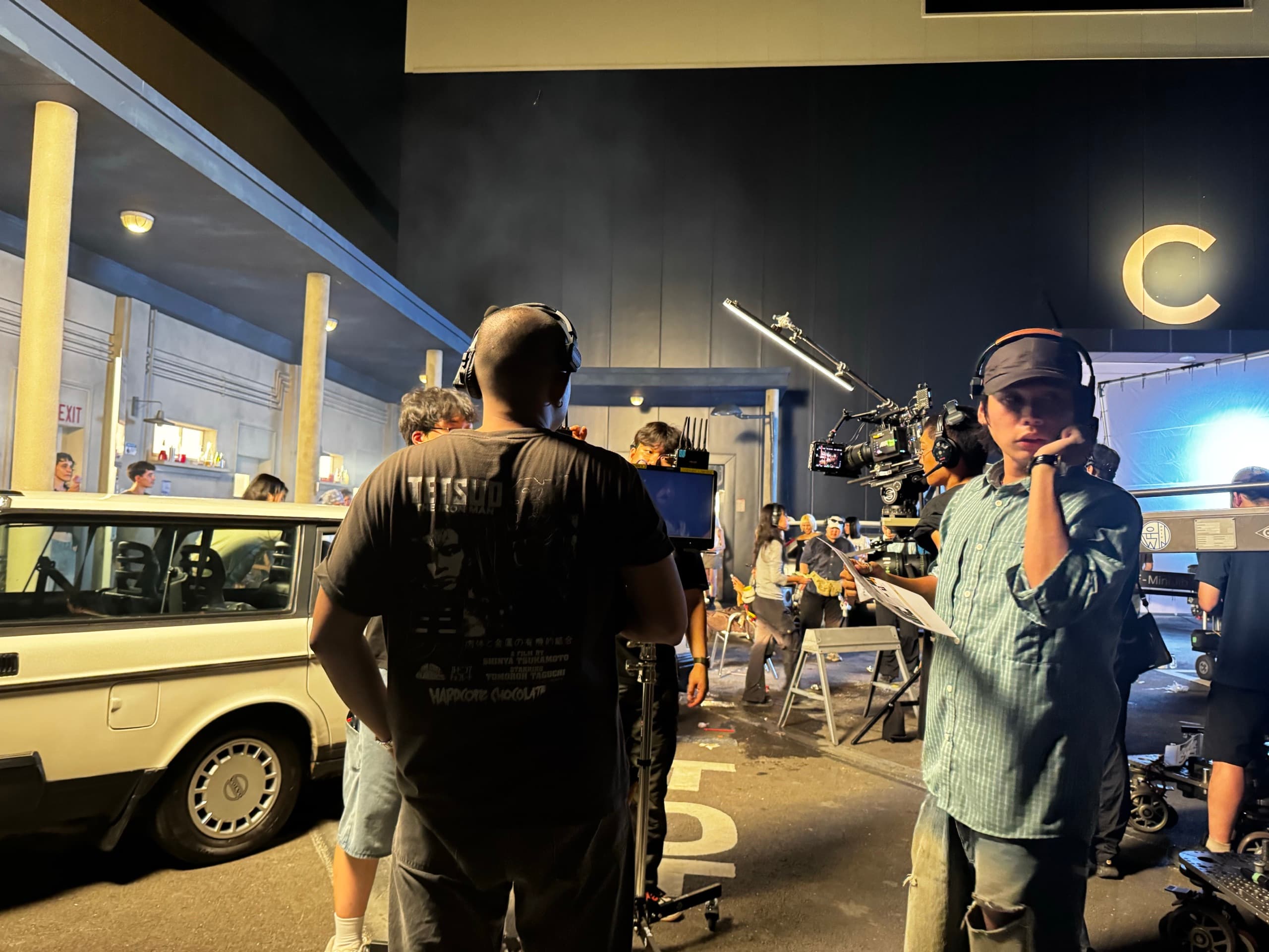 Night backlot set with picture car